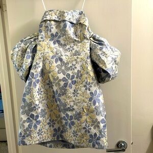 Beautiful flower off the shoulder dress with accent sleeves on the shoulders.